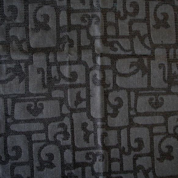 luxor displaying the black color version of a heavy weight pure silk brocade with abstract Egyptian styled pattern