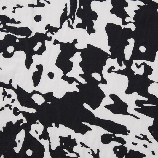 Presenting Calypso a black and white colored splotchy print on soft breathable and lightweight pure cotton featuring moderate drape