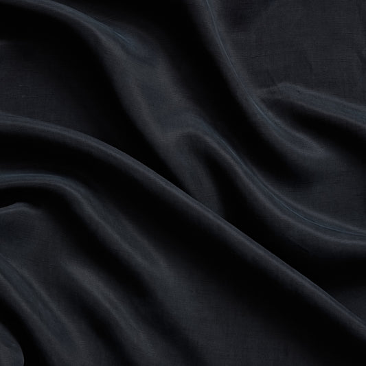 marcello displaying the navy color version of a linen blend with Tencel and Cuprammonium featuring a subtle satin sheen and fluid drape