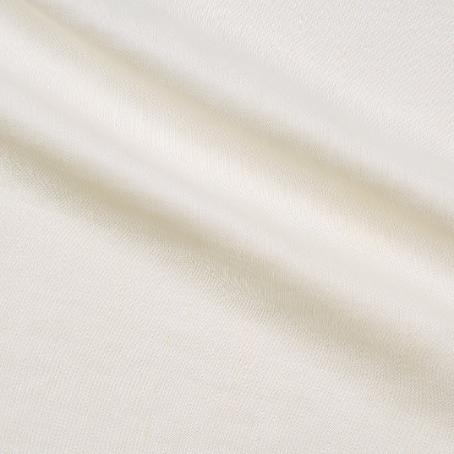 marcello presenting the ivory color version of a linen blend with Tencel and Cuprammonium featuring a subtle satin sheen and fluid drape