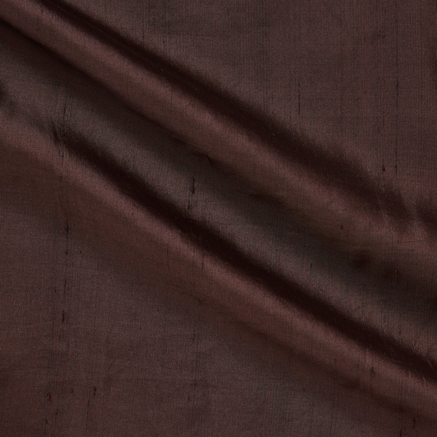Exhibiting medusa in the sable color version of a shantung like breathable silk and rayon blend with natural silk sheen and textured slubs