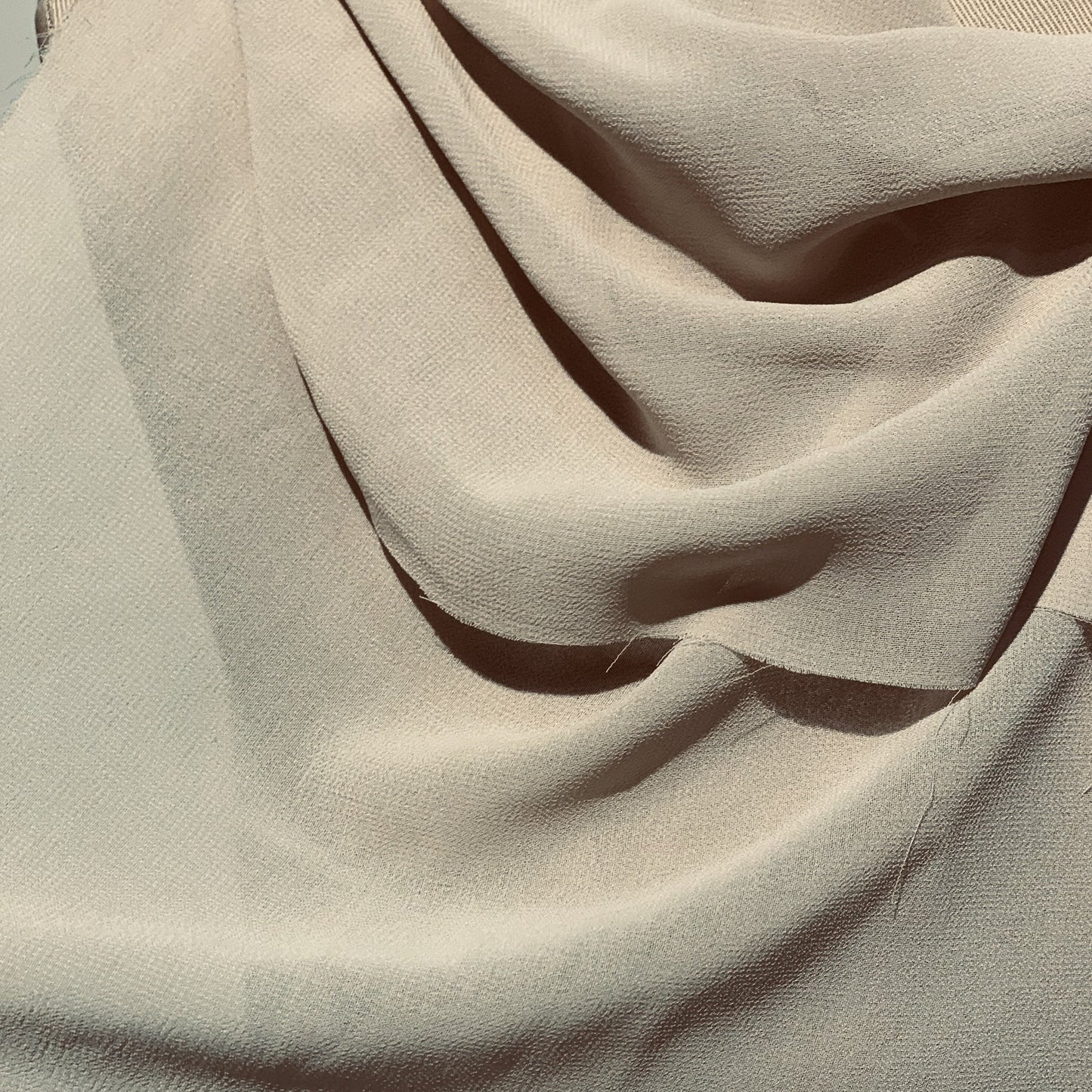 microgette presenting the champagne color version of a sheer Polyester microfibre with good drape close up