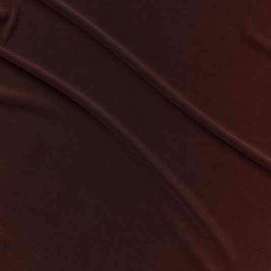 Presenting optima a chocolate colored slinky and soft stretch acetate blend with fluid drape