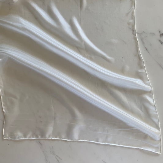 Presenting pajeant scarf featuring a natural colored soft pure silk 28cm x 160cm corner with rolled edge and floaty fluid drape