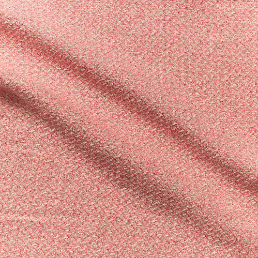phoenix demonstrating the coral color version of a textured tweed look yard dyed heavy weight pure silk with lurex highlights