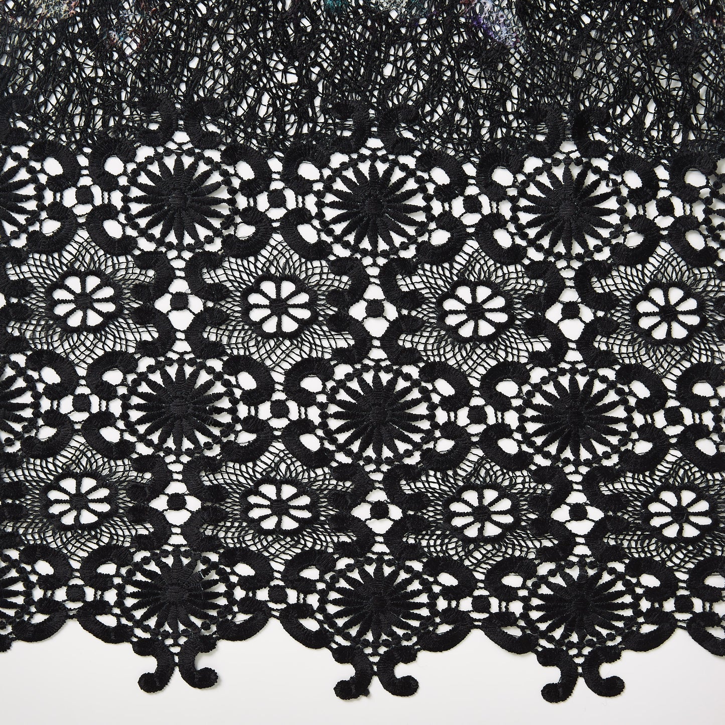 rosalie presenting a close up of the lace with doubled scalloped edge on pure polyester suitable for occasion wear