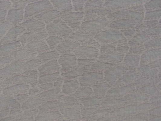 mythical presenting the beige color version of a fish scale jacquard light weight pure rayon with good drape