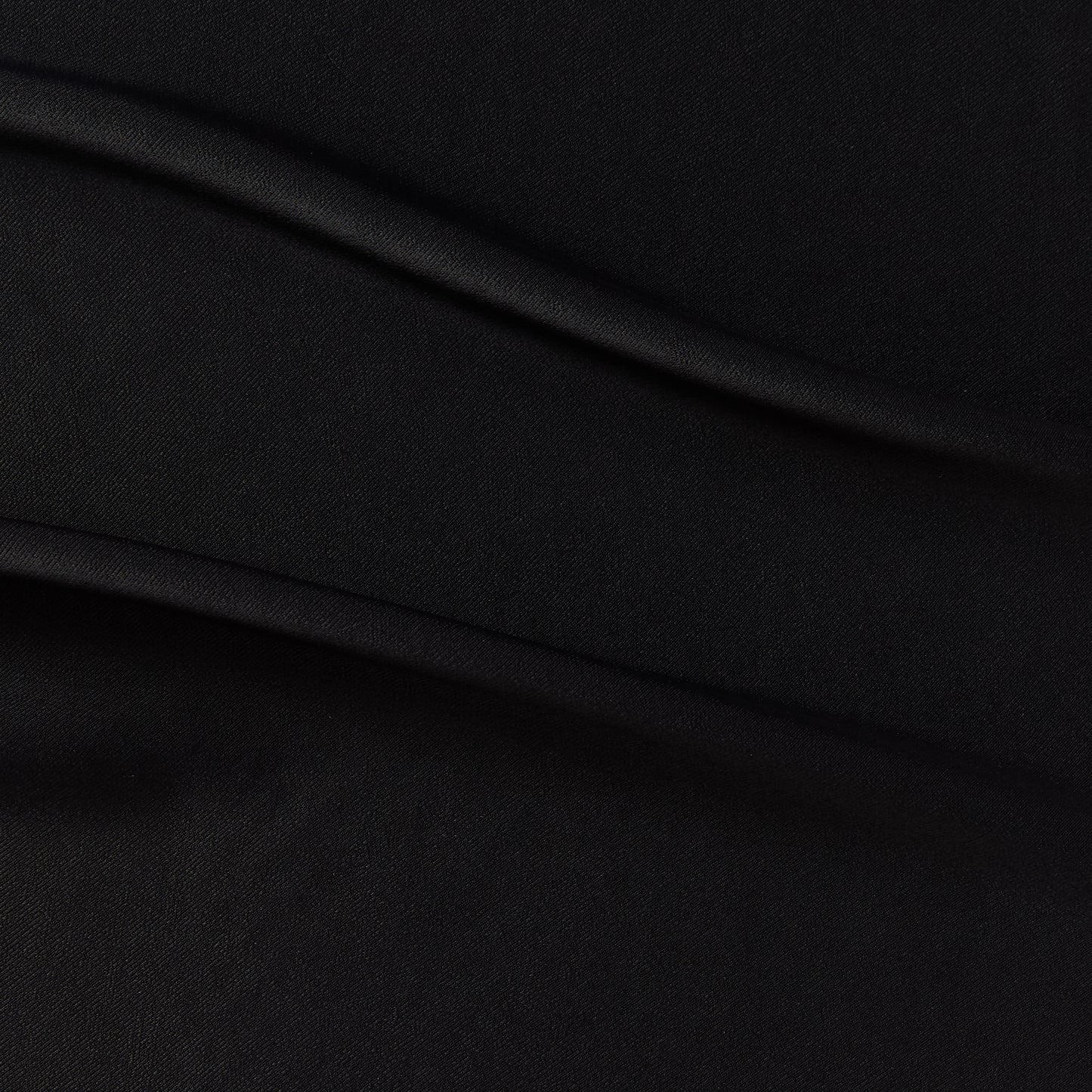 sakura presenting the black color version of a satin bamboo and viscose blend with both satin and matte faces featuring fluid drape