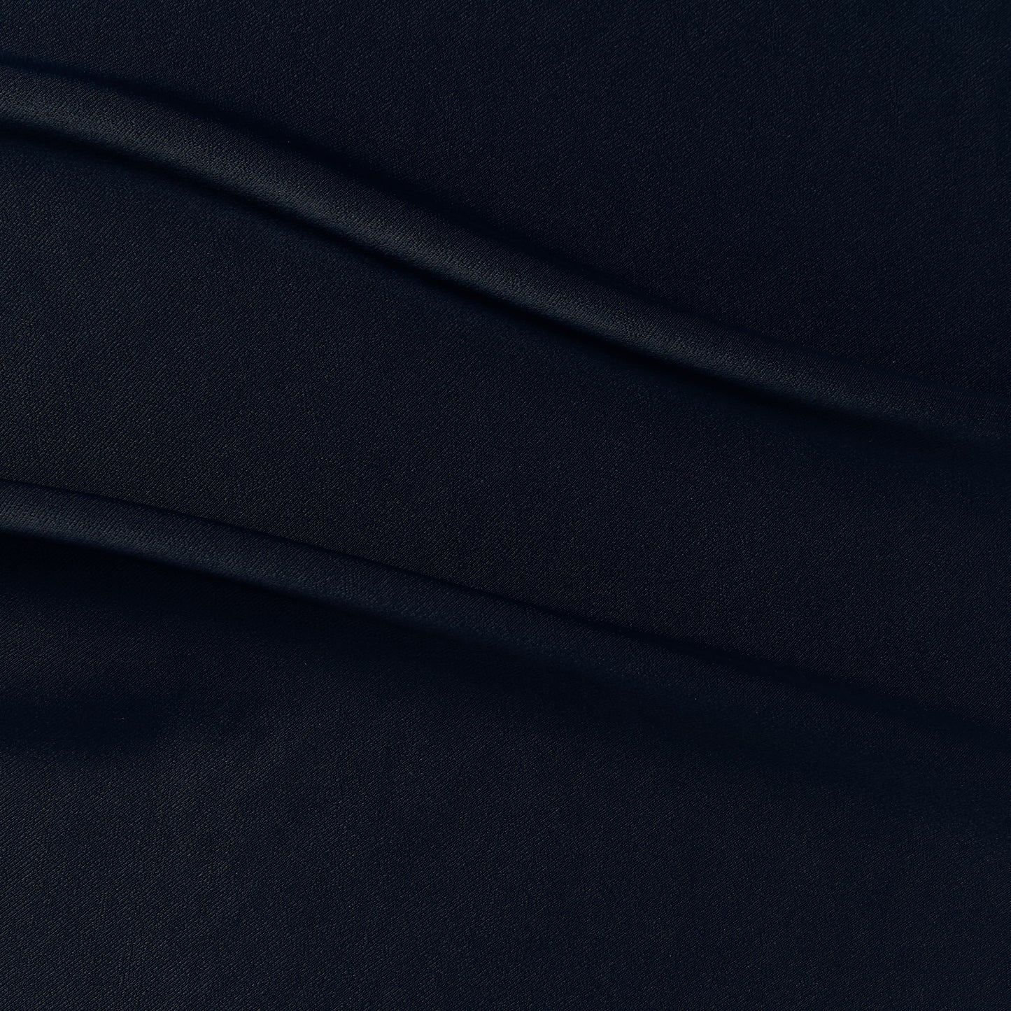 sakura presenting the Ink color version of a satin bamboo and viscose blend with both satin and matte faces featuring fluid drape