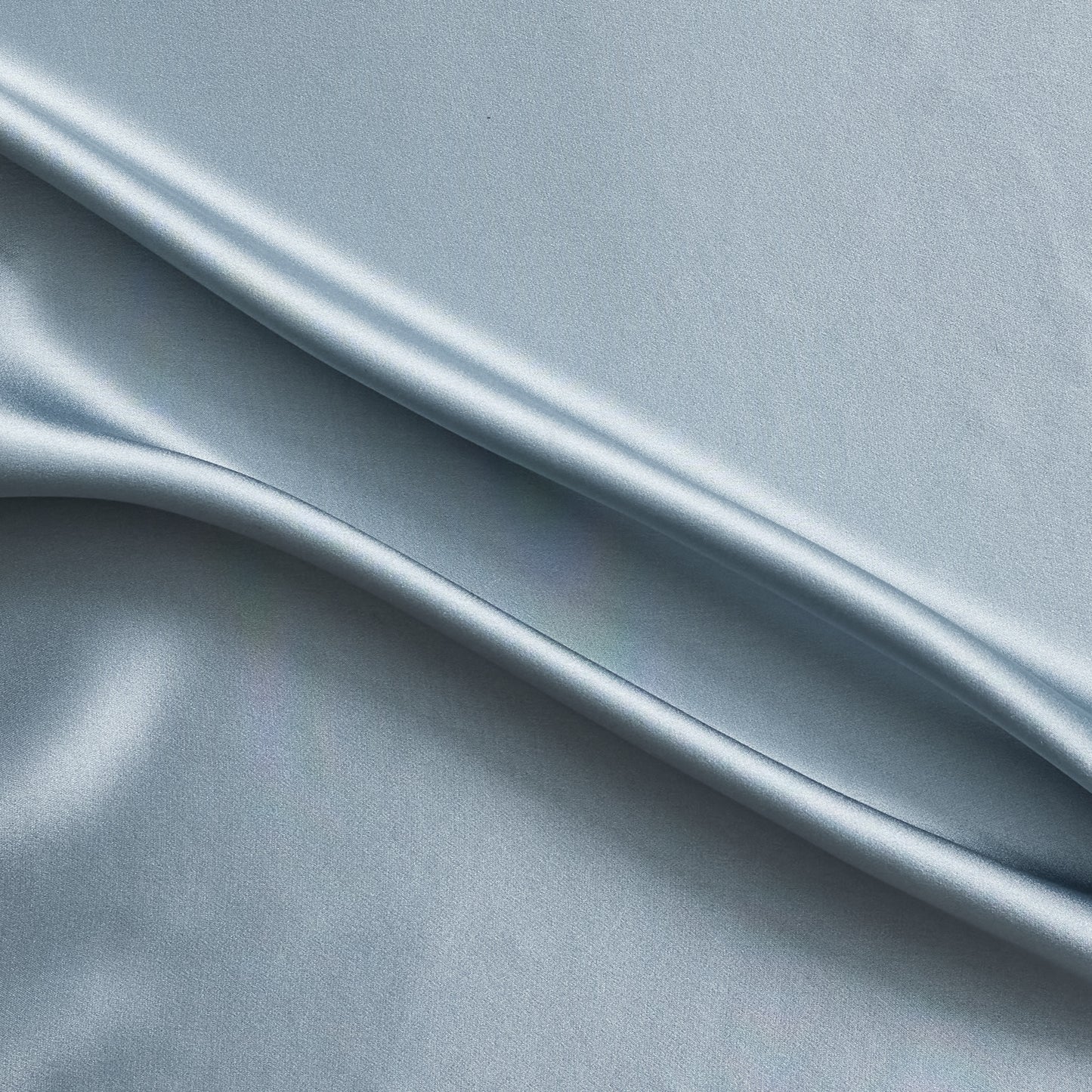 Silk Satin presenting the Powder color version of a Soft Pure mulberry silk with natural sheen and fluid drape
