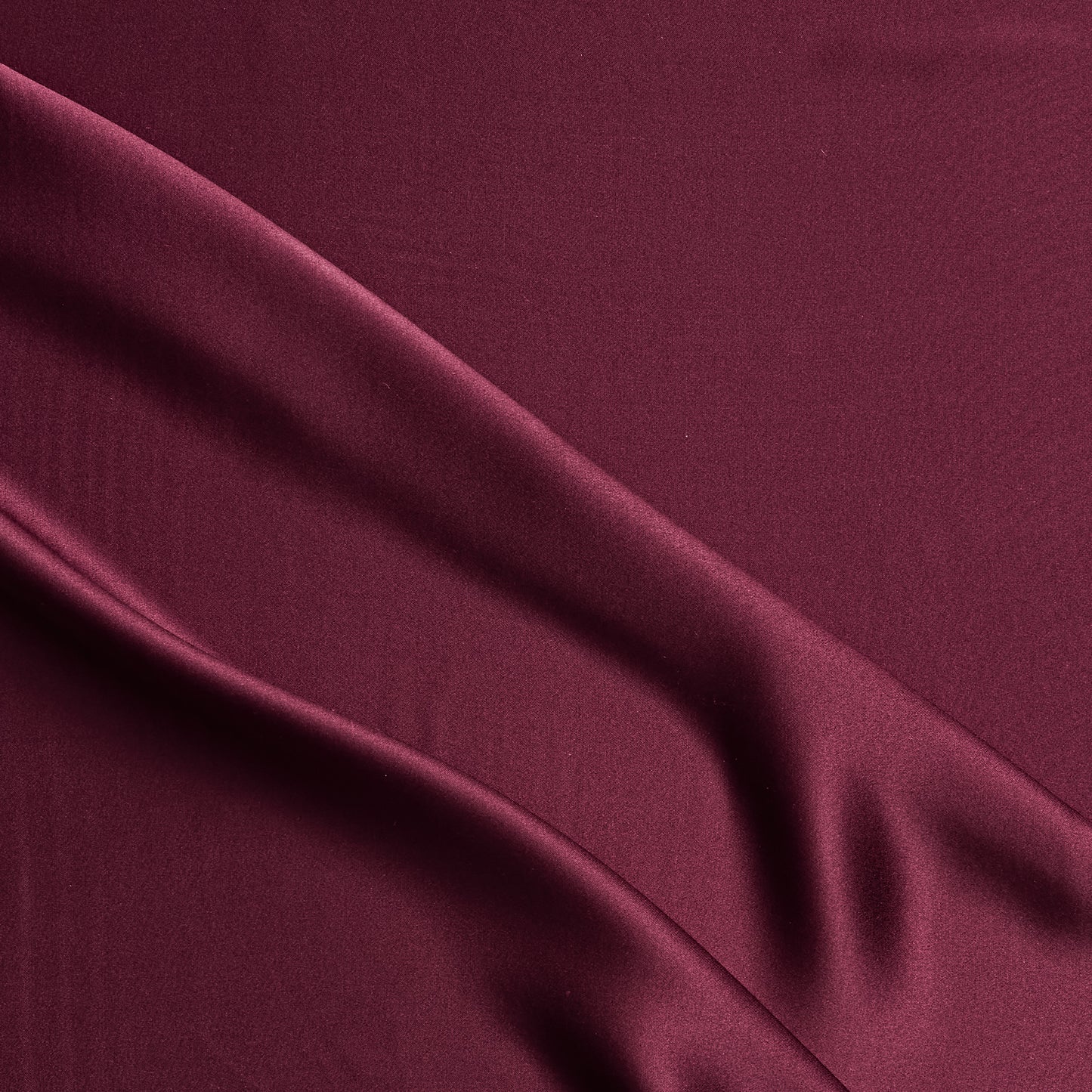 Silk Satin showing the Ruby color version of a Soft Pure mulberry silk with natural sheen and fluid drape