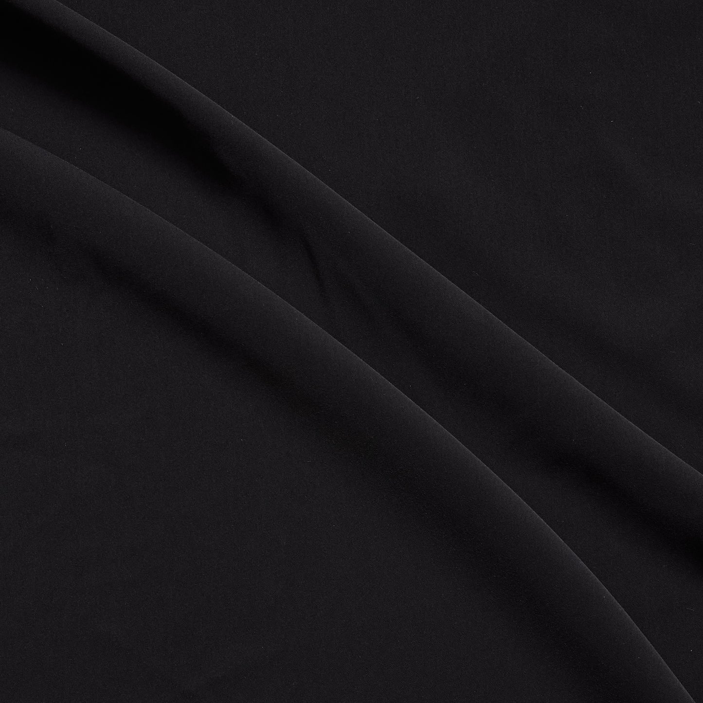 sensation presenting the black color version of a medium weight silk faille-like pure polyester with weft natural stretch and fluid drape