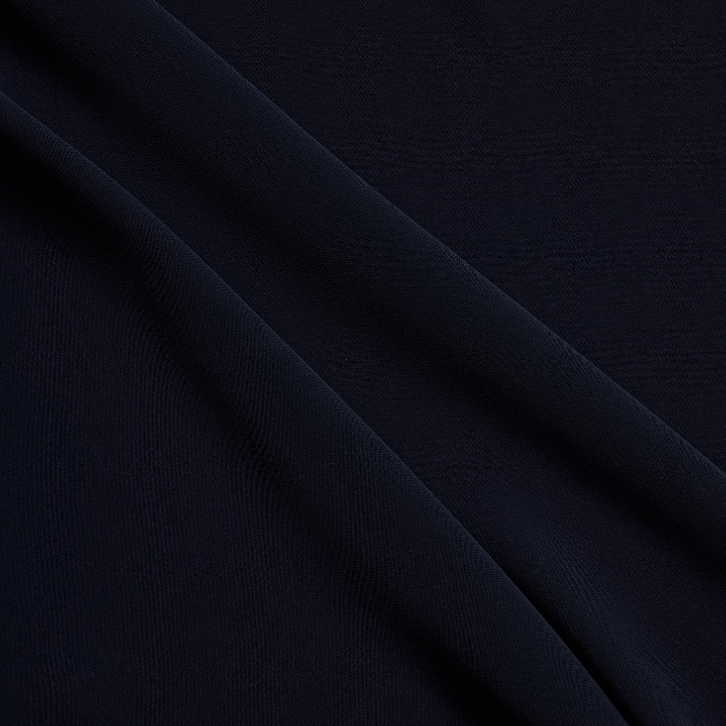 sensation presenting the navy color version of a medium weight silk faille-like pure polyester with weft natural stretch and fluid drape