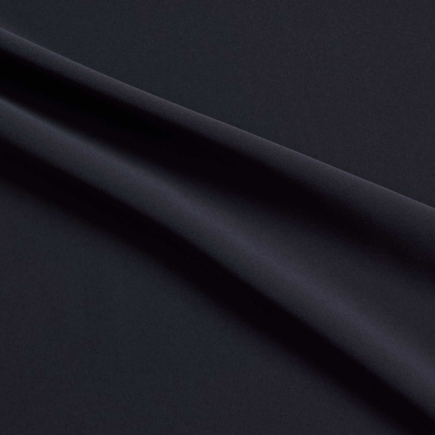 sensation presenting the charcoal color version of a medium weight silk faille-like pure polyester with weft natural stretch and fluid drape
