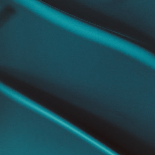 sensation presenting the  jewel color version of a medium weight silk faille-like pure polyester with weft natural stretch and fluid drape