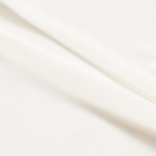 Crepe De Chine presenting the Natural color version of a Pure mulberry silk with fluid drape and a matte face and cool handle