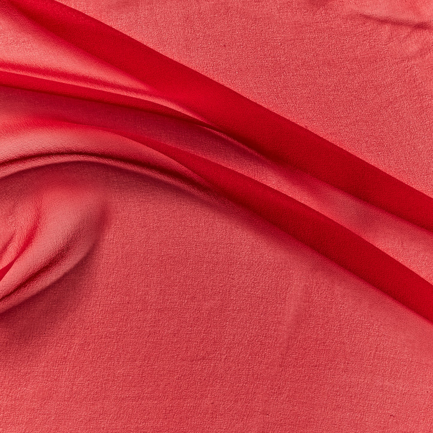 silk georgette presenting the scarlet color version of a Lightweight sheer floaty pure silk with excellent drape great for layering and gathering