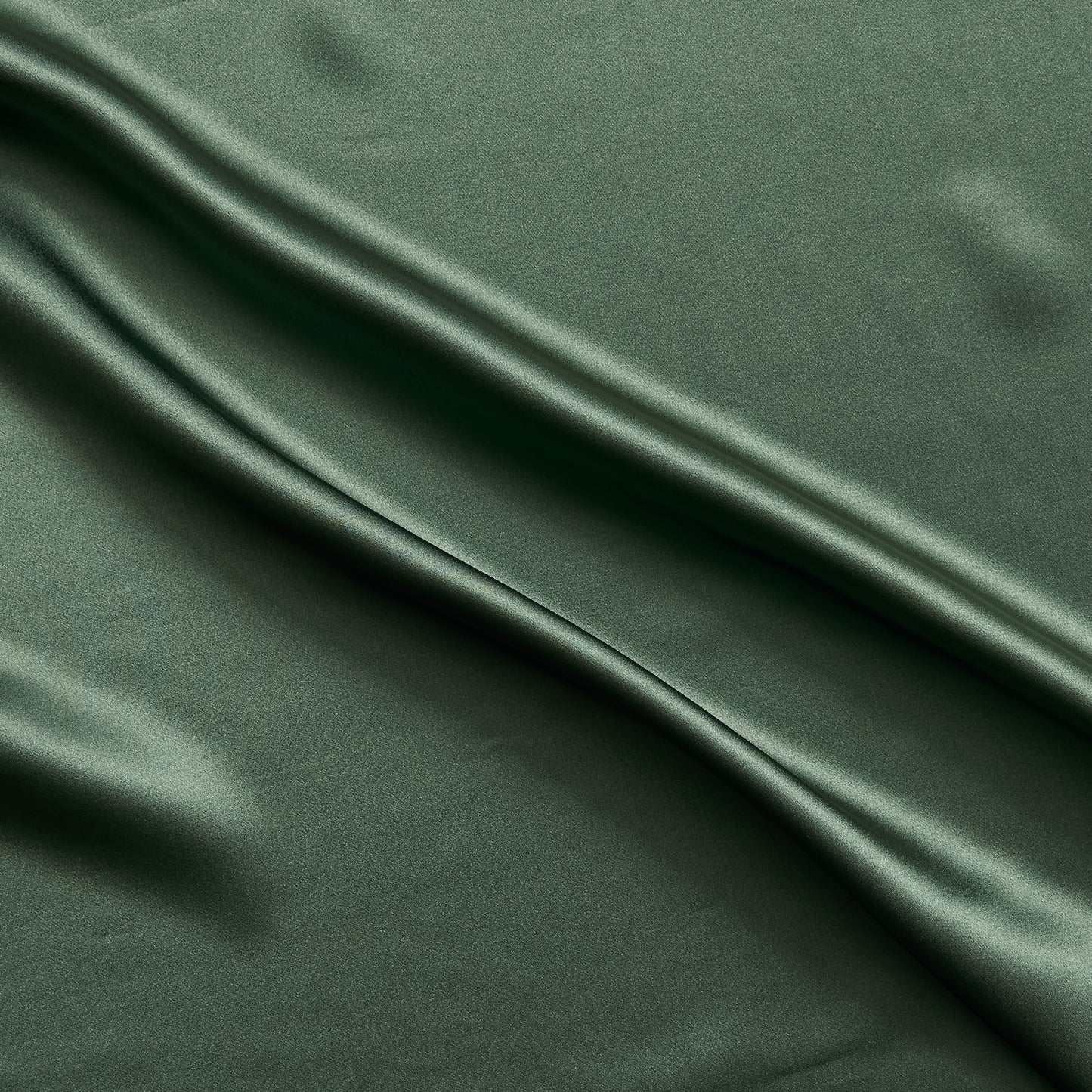 Silk Satin presenting the Forest color version of a Soft Pure mulberry silk with natural sheen and fluid drape