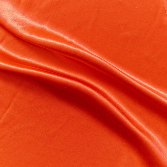 Silk Satin presenting the  lava color version of a soft pure mulberry silk satin with natural sheen and fluid drape