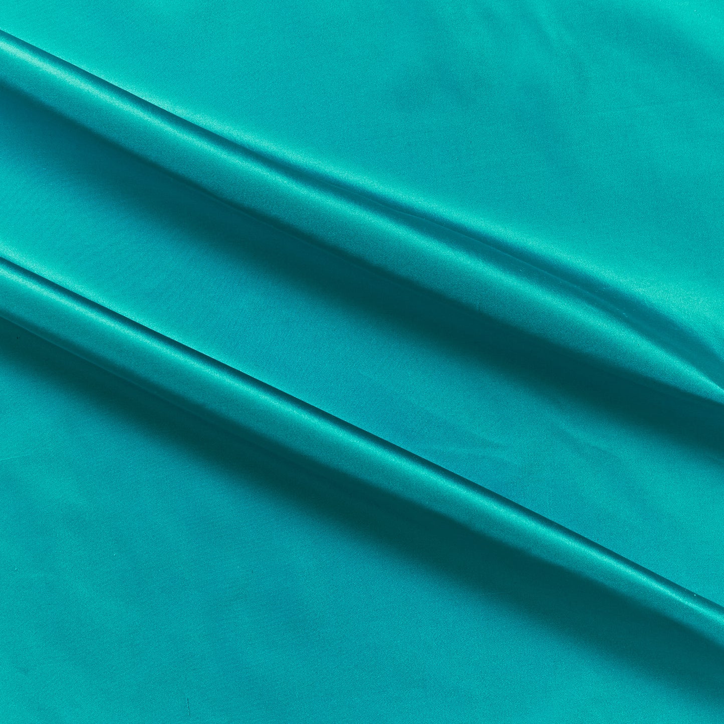 silk taffeta presenting the turquoise color version of a smooth crisp pure silk with good drape