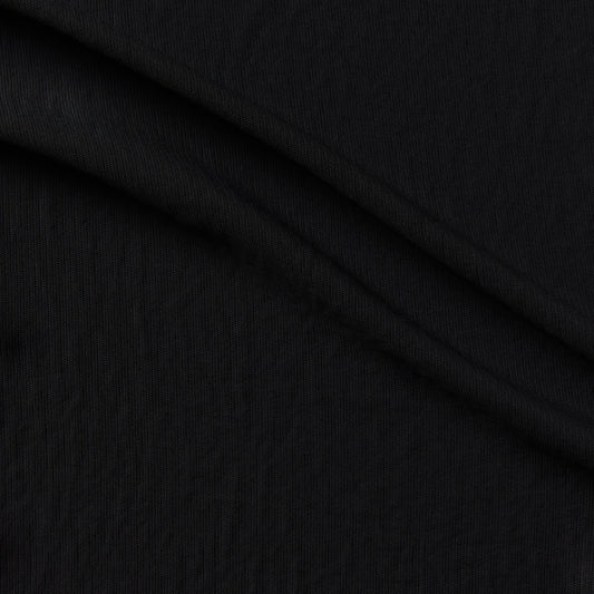 sirocco showing the black color version of a soft pure polyester with textured face fluid drape and soft hand feel