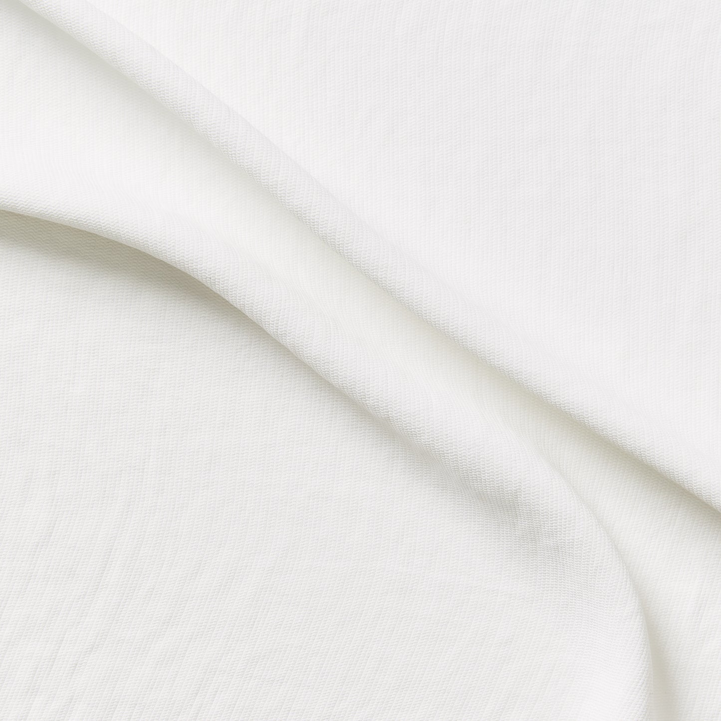 sirocco presenting the ivory color version of a soft pure polyester with textured face fluid drape and soft hand feel