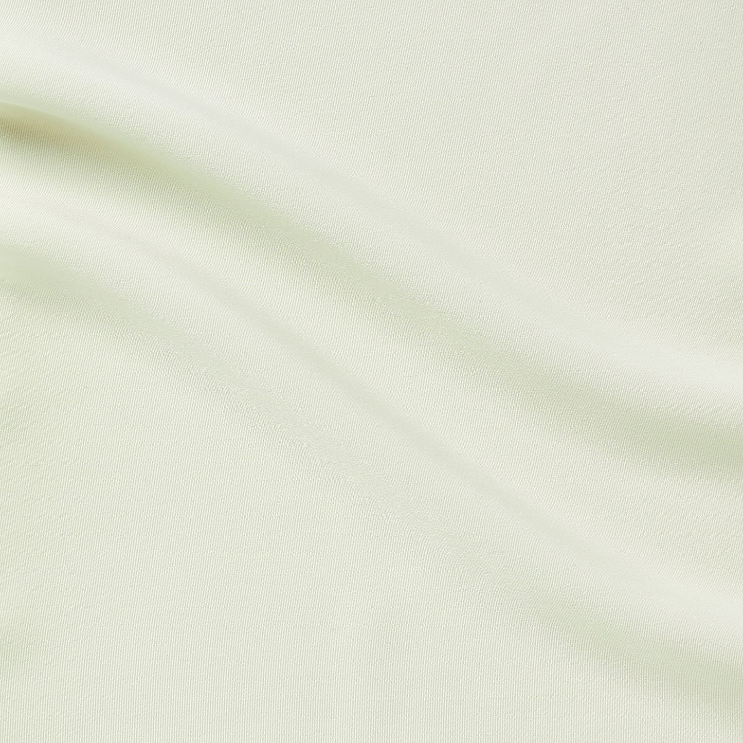 sistine exhibiting the ivory color variant of a soft and smooth pure polyester with silky hand feel and fluid drape