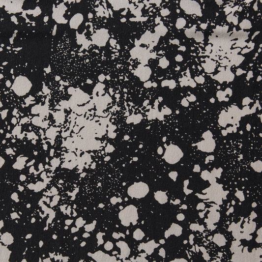 Showing splash a black and white blotchy digital print jersey knit stretch rayon with spandex