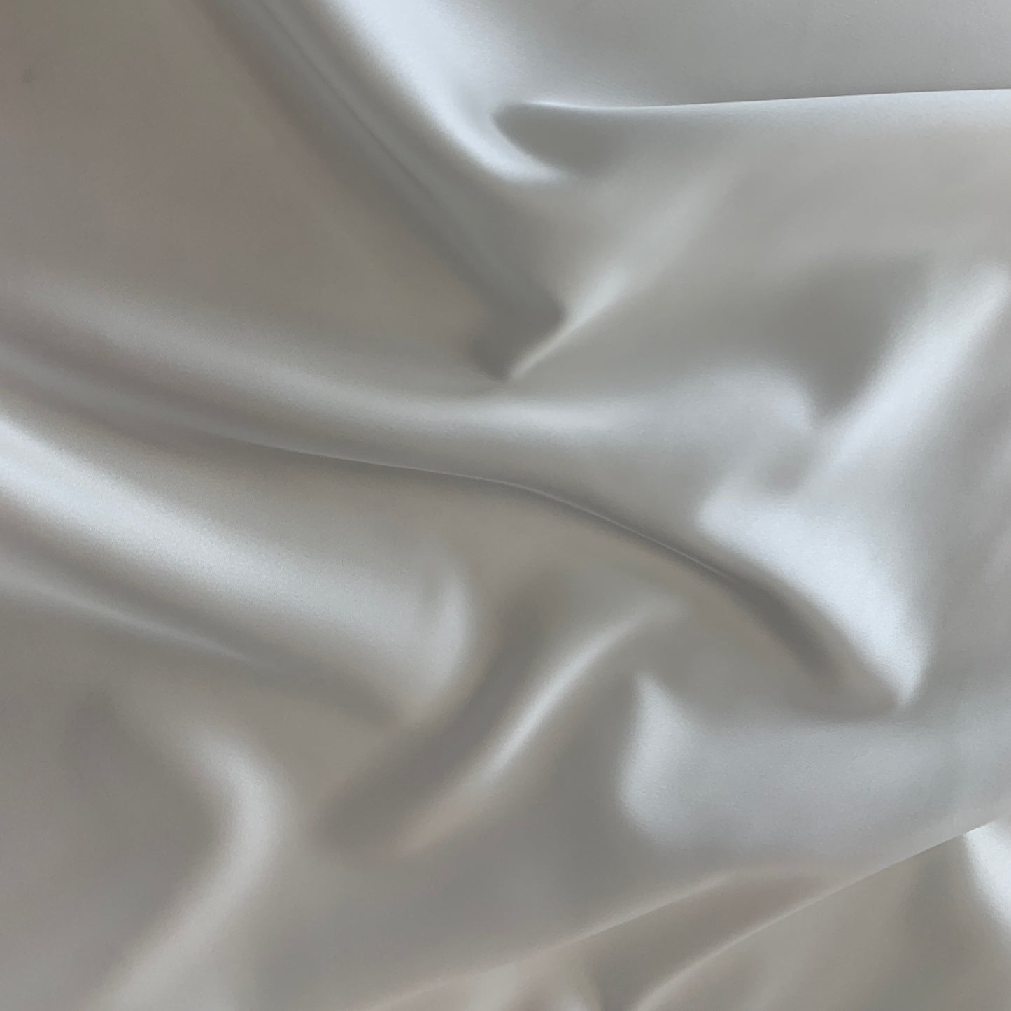 Presenting Stella heavy stretch satin a ivory colored polyester Microfiber and Spandex blended fabric