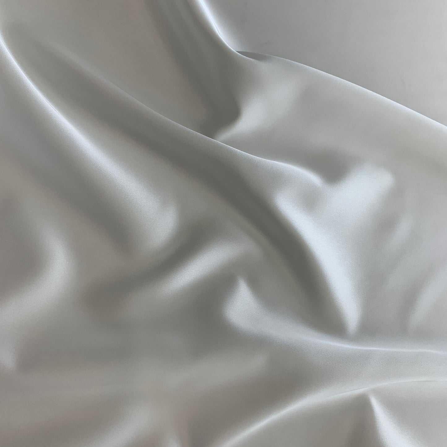 Presenting Stella heavy stretch satin a ivory colored polyester Microfiber and Spandex blended fabric