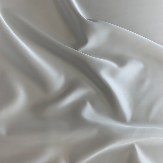 Displaying Stella heavy stretch satin a ivory colored polyester Microfiber and Spandex blended fabric