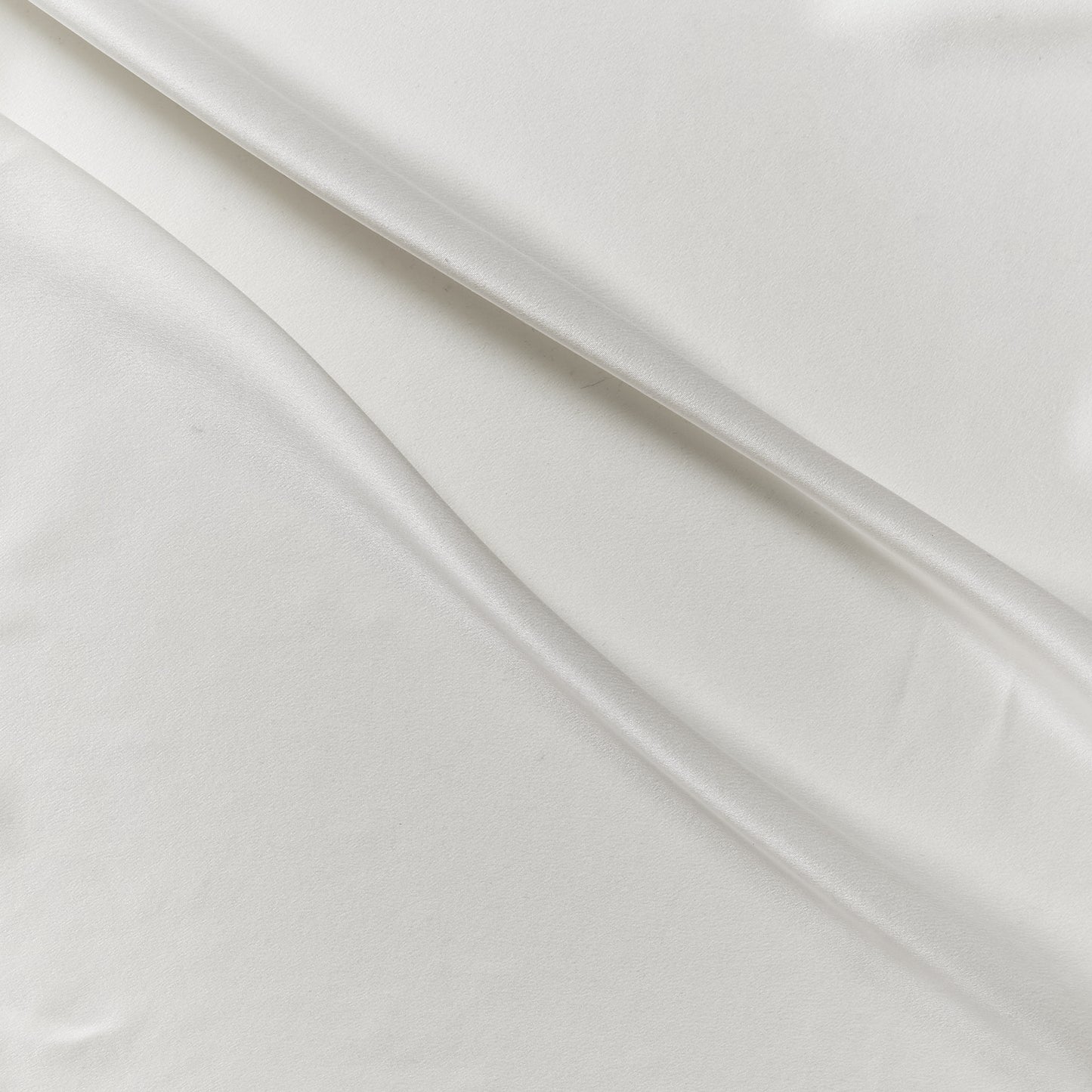 supremo exhibiting the ivory color version of a sand washed soft delustered pure silk with fluid drape