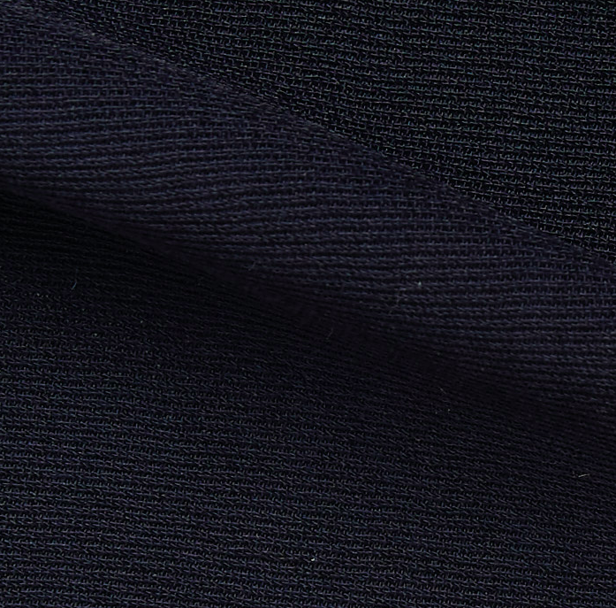 ultima presenting the navy color version of a polyester and acetate blend semi sheer mid weight textured fabric with fluid drape close up