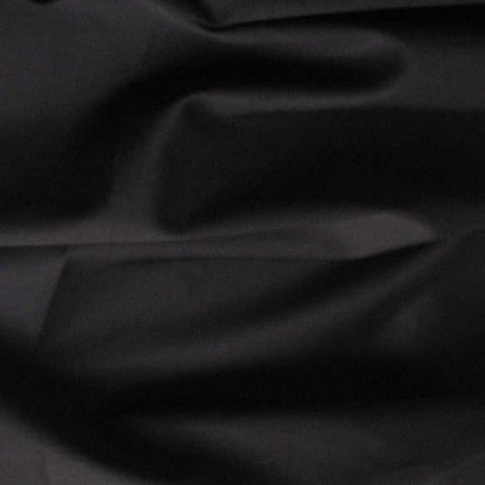 Showing Sateen Cotton and Spandex a black colored Stretch Sateen with moderate drape Folds