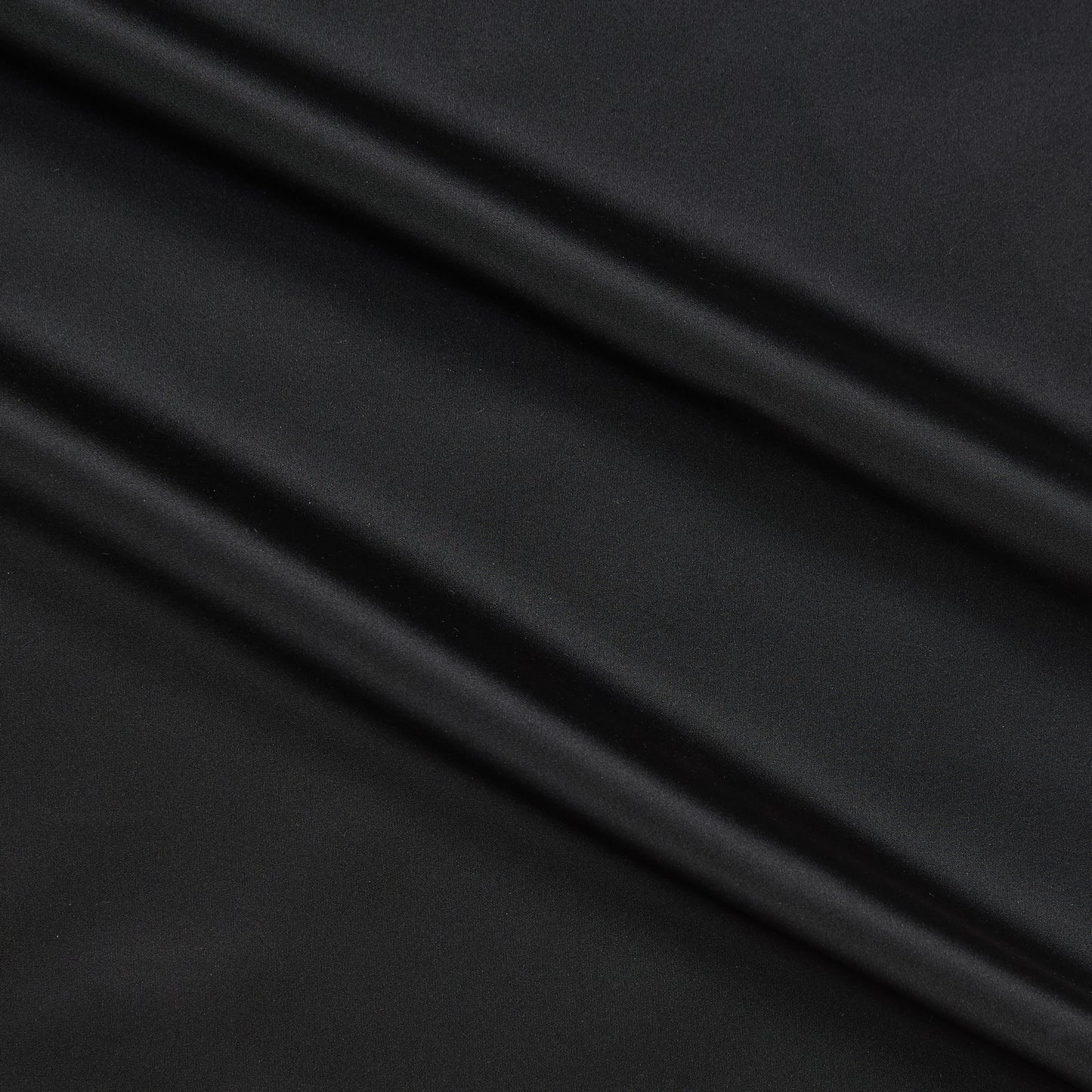 Tatler presenting the Black color version of a pure Polyester crisp smooth and lightweight shot taffeta with lustre