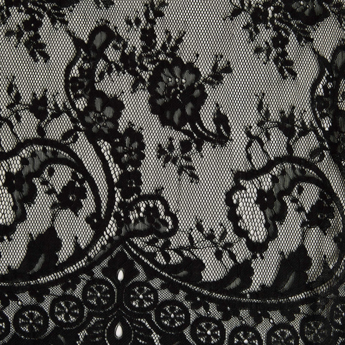 Presenting tivoli the black color version of an antique panelled lace with eyelash detailing on a nylon, rayon and cotton blend with metallic print