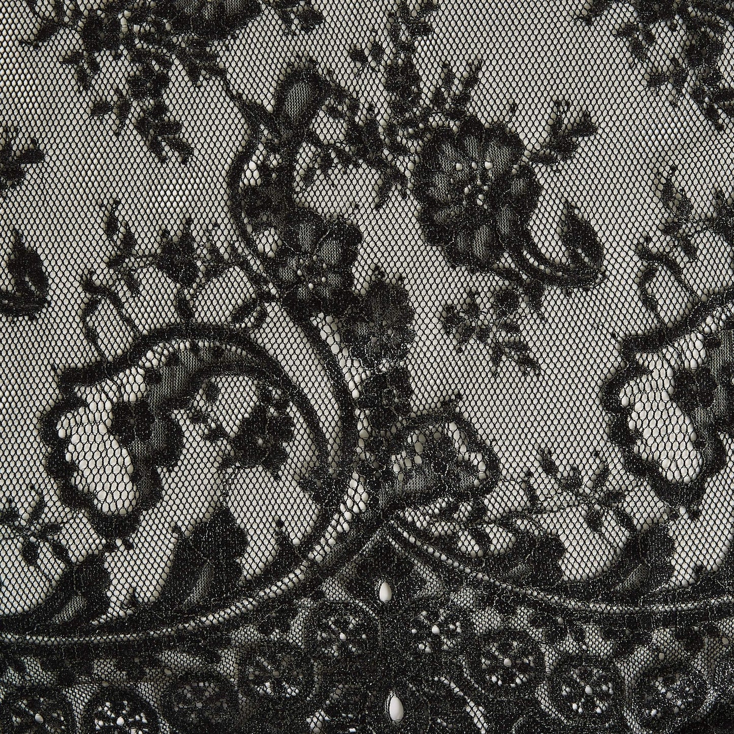 Presenting Tivoli a metallic antique Black panelled lace with eyelash detailing on a nylon, rayon and cotton blend with metallic print