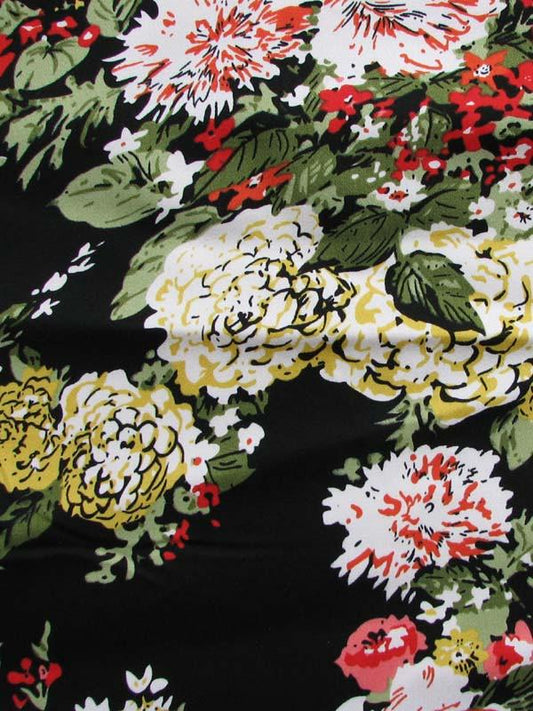 Tess showing a a painterly Floral Print Stretch Cotton Blend with spandex closeup