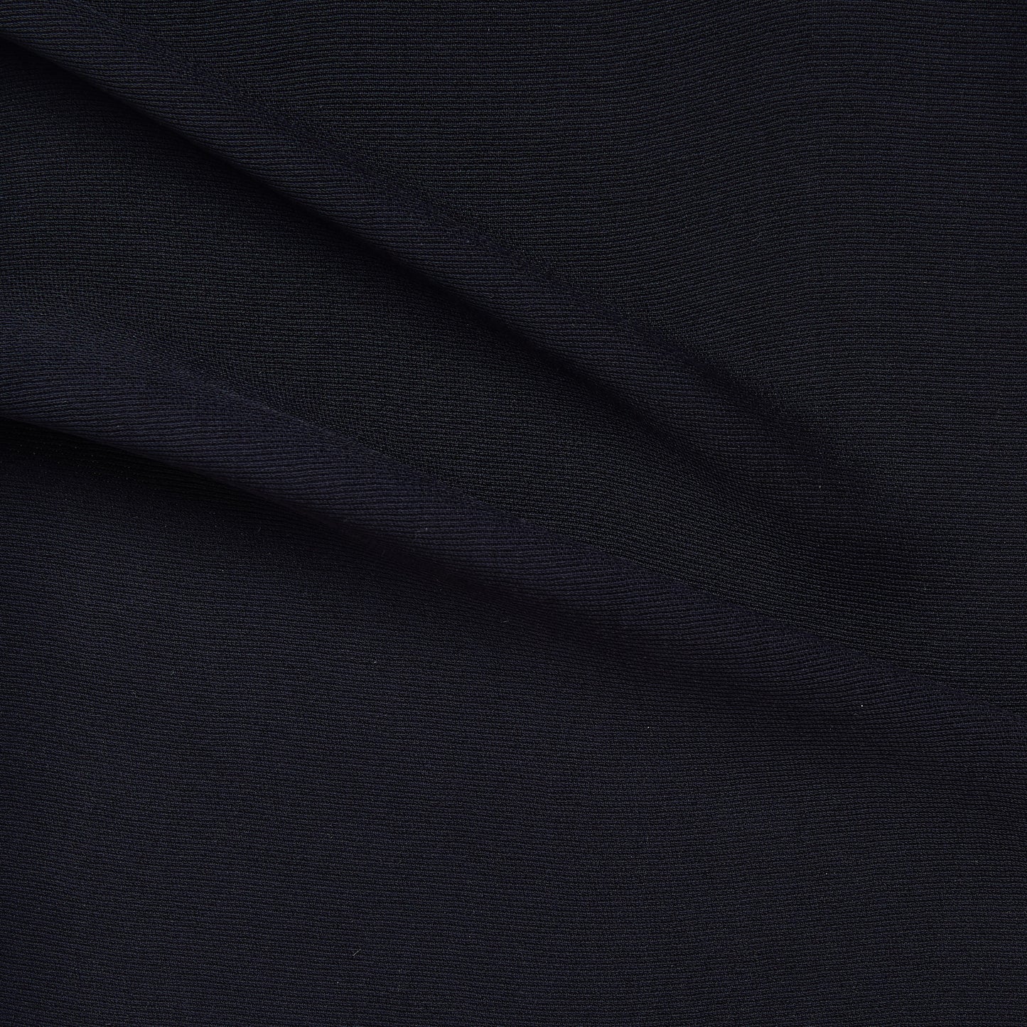 ultima presenting the navy color version of a polyester and acetate blend semi sheer mid weight textured fabric with fluid drape