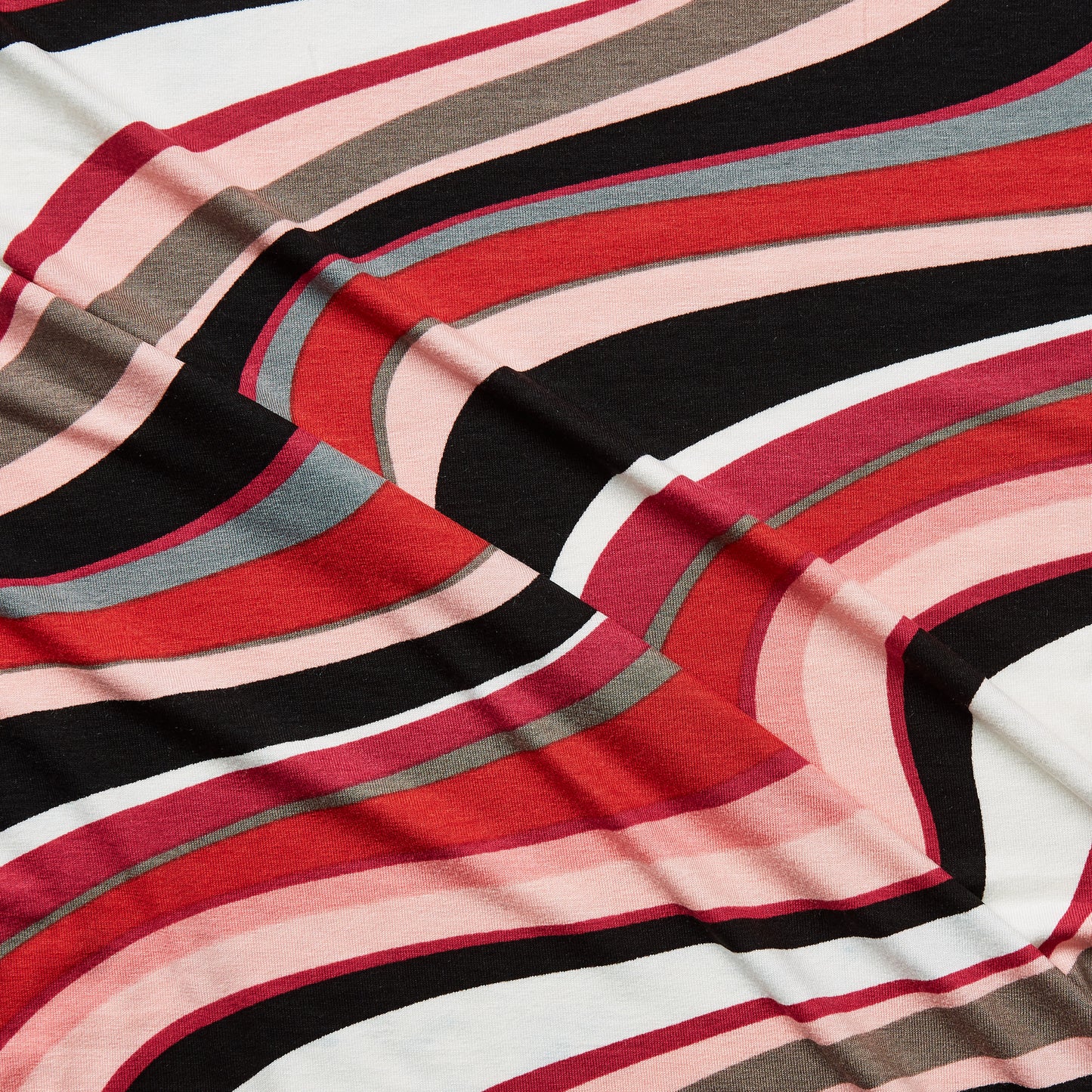 vortex presenting the pink color version of a stretch soft jersey knit with wavy digital print rayon with spandex for figure hugging