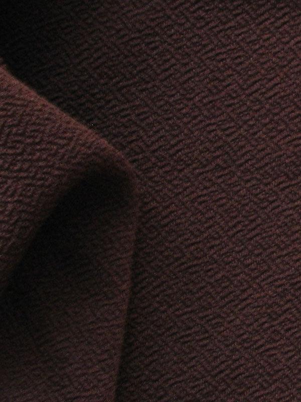 Exhibiting a closeup of the Voltage chocolate color version of a Stretchable Smooth Acetate and polyester Blend with spandex and featuring fluid drape
