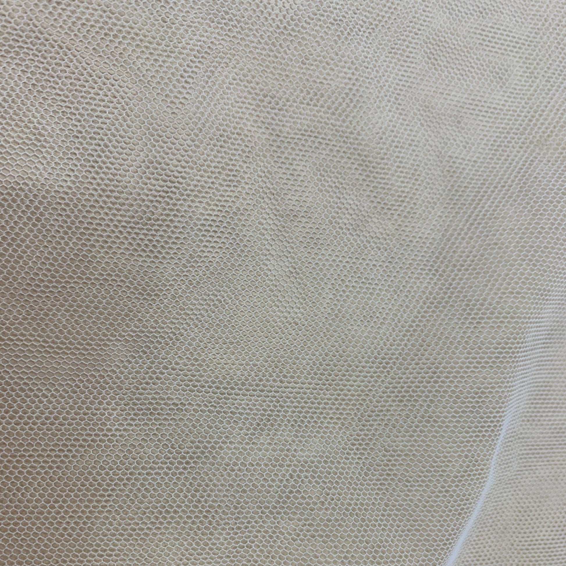 Presenting Angel Tulle an ivory colored sheer soft pure nylon tulle in close up