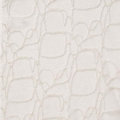 Exhbiting bedlam ae ivory color fabric with an elegantly simple embroidered design on ivory mesh base as a polyester and rayon blend 