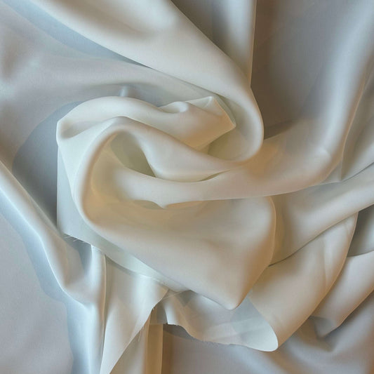 Presenting Bliss a dressweight ivory Poly weft stretch yarn with excellent softness and drape