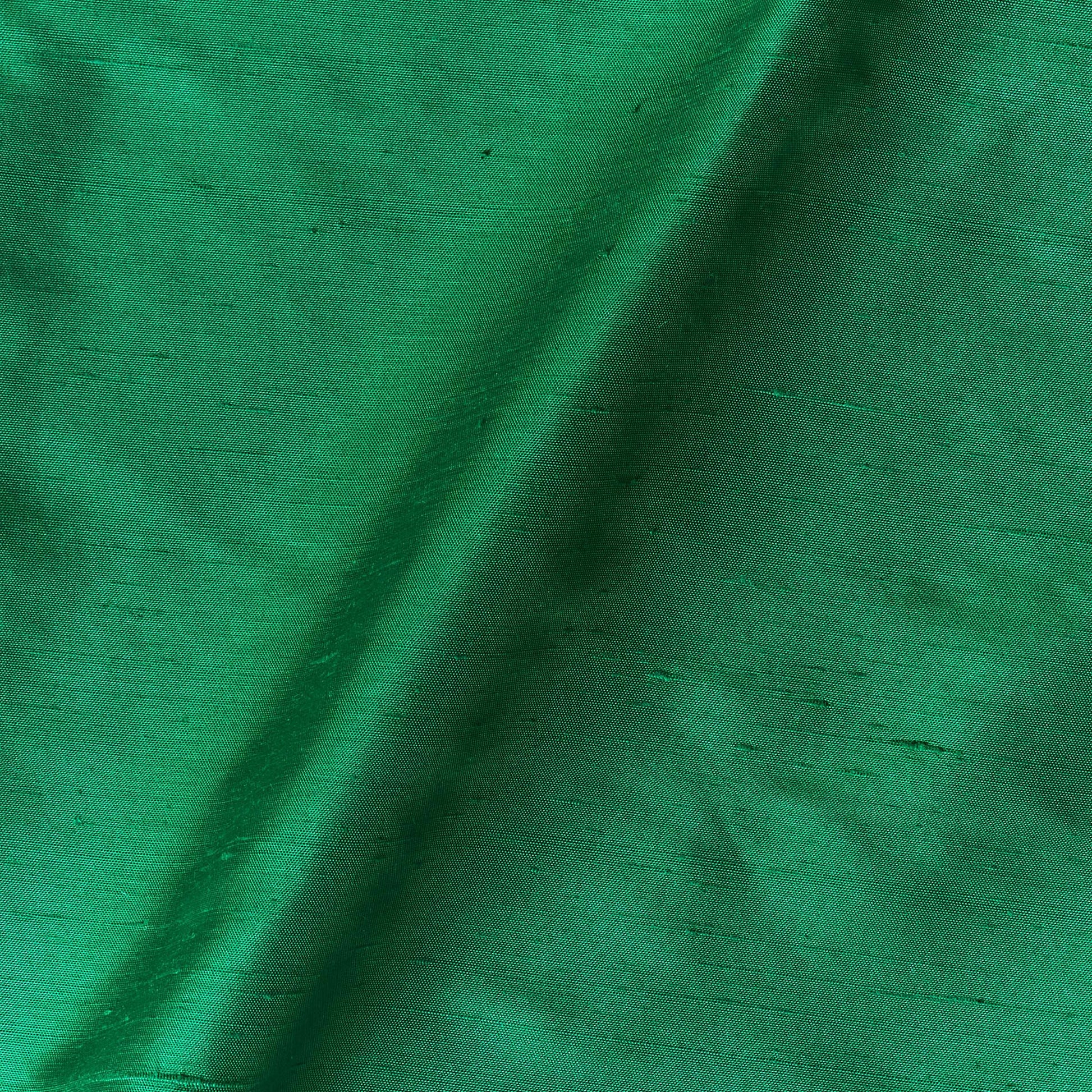 Presenting Bohai Dupion pure silk in an emerald shade with moderate drape