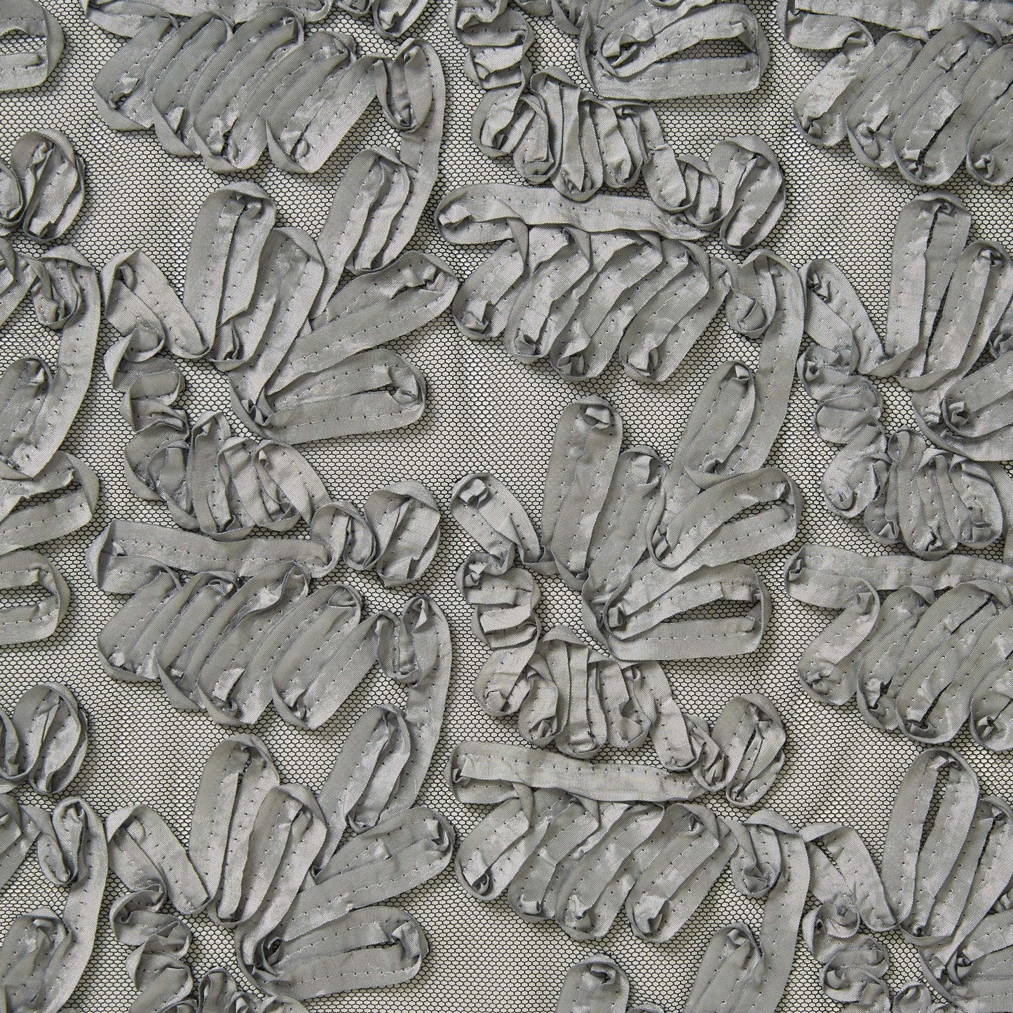 Presenting burbs silver colored fabric featuring abstracted floral design with embroidered ribbon on polyester silver mesh 