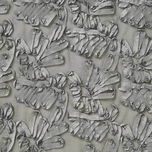 Presenting burbs silver colored fabric featuring abstracted floral design with embroidered ribbon on polyester silver mesh 