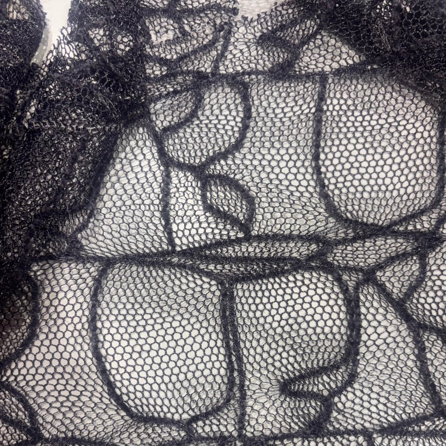 Exhibiting a closeup of the intricate lace pattern of Bedlam