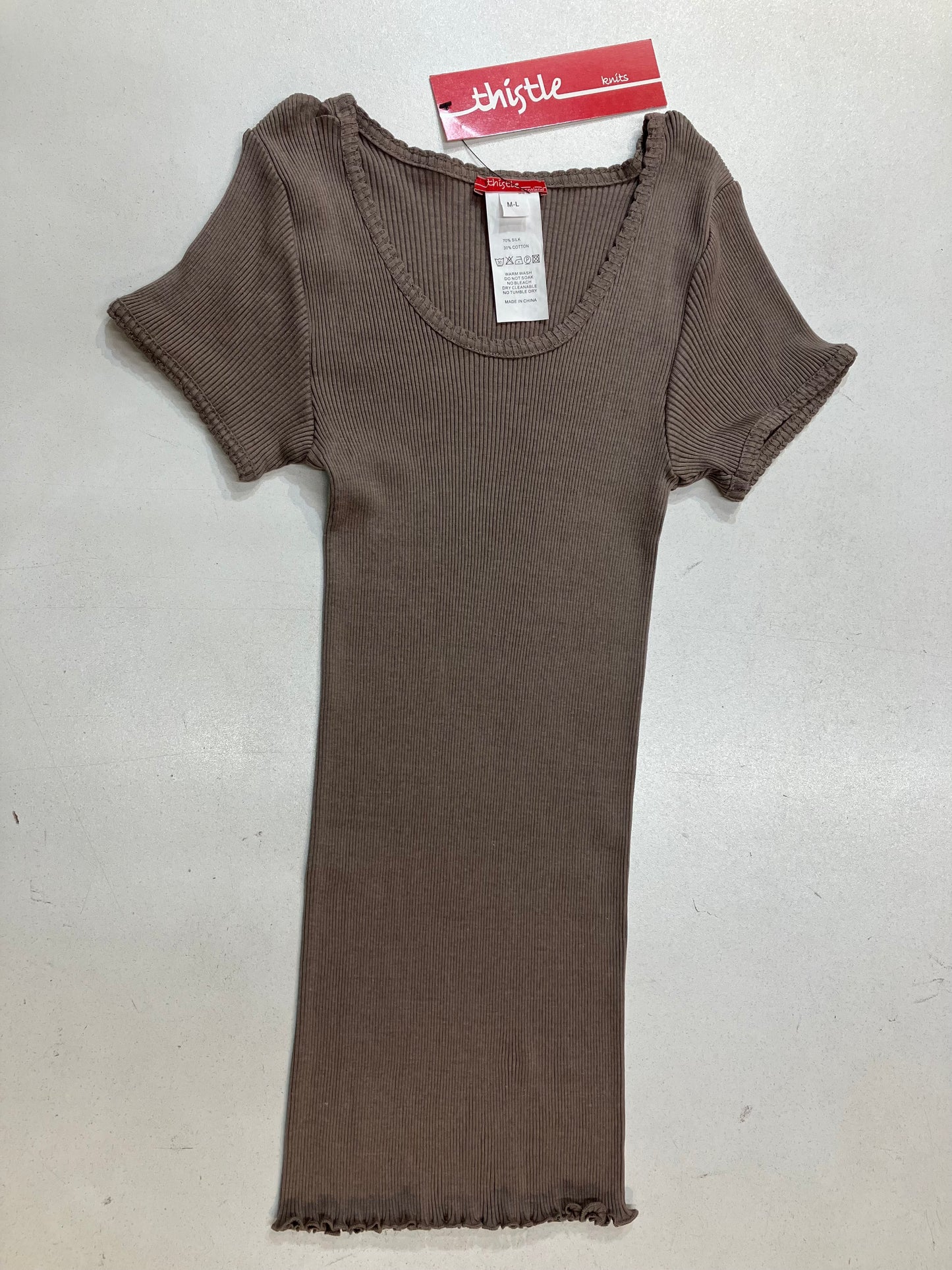 Presenting a coffee colored silk and cotton cotton rib knit top with cap sleeves