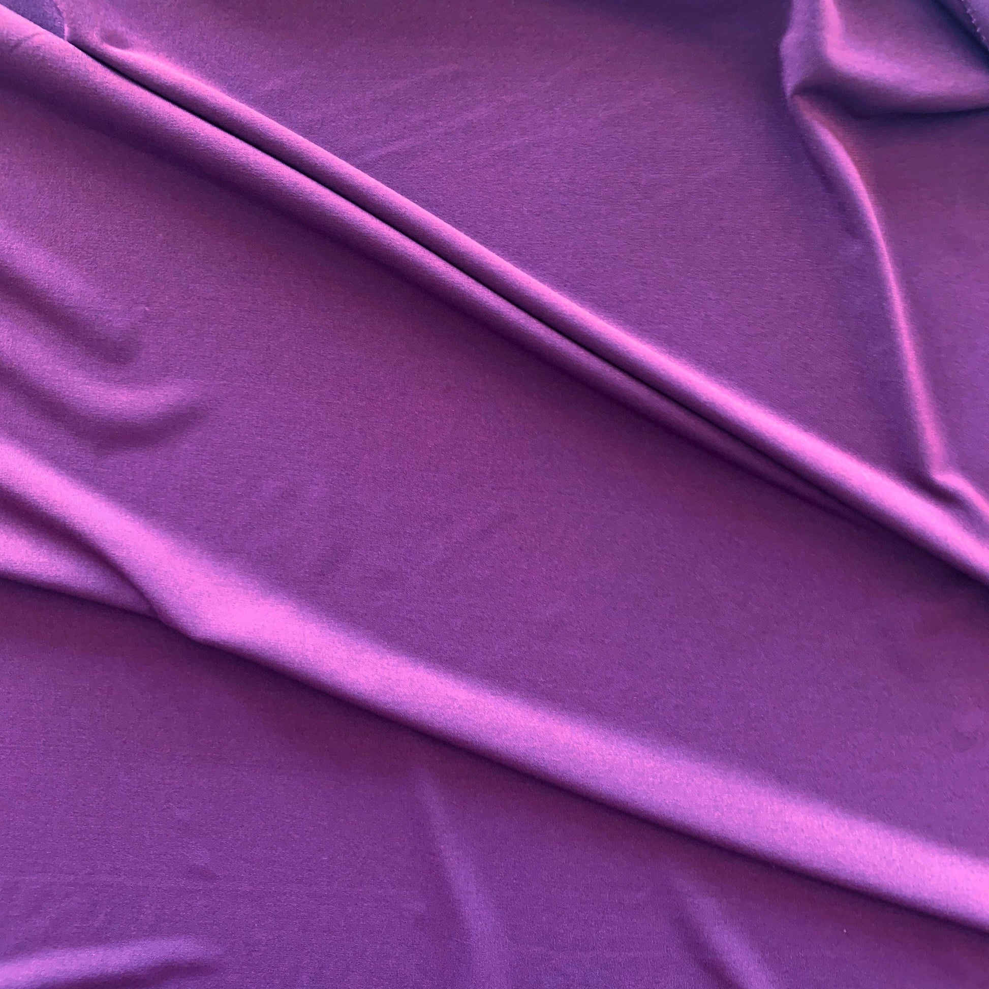 cavall presenting the plum color version with stretch smooth fine knit jersey polyester with added spandex